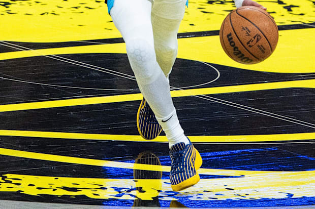 Tyrese Haliburton's blue and gold PUMA shoes.