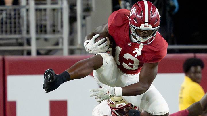 Sep 19, 2026; Tuscaloosa, AL, USA;  Alabama quarterback John Gazzaniga (13) Alabama running back EJ Crowell (13) leaps over Florida State defensive back Ricky Knight III (26) at Bryant-Denny Stadium. Alabama defeated Florida State 50-36. Mandatory Credit: Gary Cosby Jr.-Tuscaloosa News
