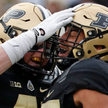 Purdue Boilermakers tight end Ben Furtney (41) and running back Devin Mockobee (45) celebrate 