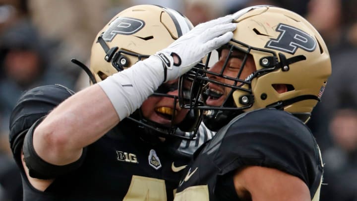 Purdue Boilermakers tight end Ben Furtney (41) and running back Devin Mockobee (45) celebrate 