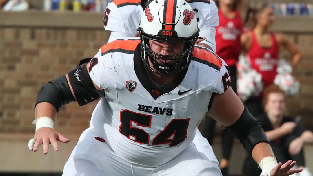 Sep 13, 2025; Lubbock, Texas, USA;  Oregon State Beavers offensive lineman Ryan Berger (65) blocks against the Texas Tech Red Raiders in the first half at Jones AT&T Stadium. Mandatory Credit: Michael C. Johnson-Imagn Images