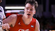 Mar 5, 2025; Cincinnati, Ohio, USA; Cincinnati Bearcats guard Simas Lukosius (41) dribbles against Kansas State Wildcats guard C.J. Jones (3) in the first half at Fifth Third Arena. Mandatory Credit: Katie Stratman-Imagn Images