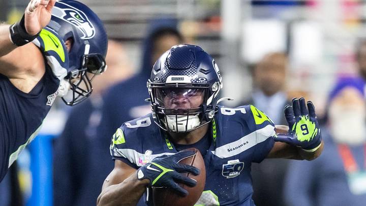 Feb 8, 2026; Santa Clara, CA, USA; Seattle Seahawks running back Kenneth Walker III (9) runs against New England Patriots linebacker Christian Elliss (53) during the third quarter in Super Bowl LX at Levi's Stadium. 