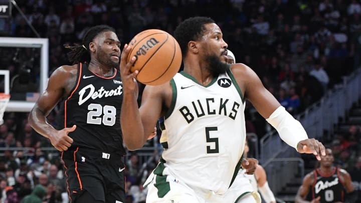 Nov 8, 2023; Milwaukee, Wisconsin, USA; Milwaukee Bucks guard Malik Beasley (5) pushes the ball up the court against Detroit Pistons center Isaiah Stewart (28) in the second half at Fiserv Forum. Mandatory Credit: Michael McLoone-USA TODAY Sports