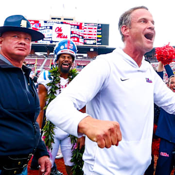 Oct 25, 2025; Norman, Oklahoma, USA;  Ole Miss Rebels head coach Lane Kiffin celebrates with fans after the game against the Oklahoma Sooners at Gaylord Family-Oklahoma Memorial Stadium. Mandatory Credit: Kevin Jairaj-Imagn Images