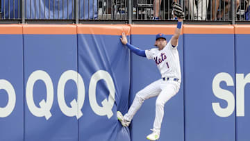Jun 25, 2025; New York City, New York, USA;  New York Mets center fielder Jeff McNeil (1) reacts after making a leaping catch in the first inning against the Atlanta Braves at Citi Field. Mandatory Credit: Wendell Cruz-Imagn Images