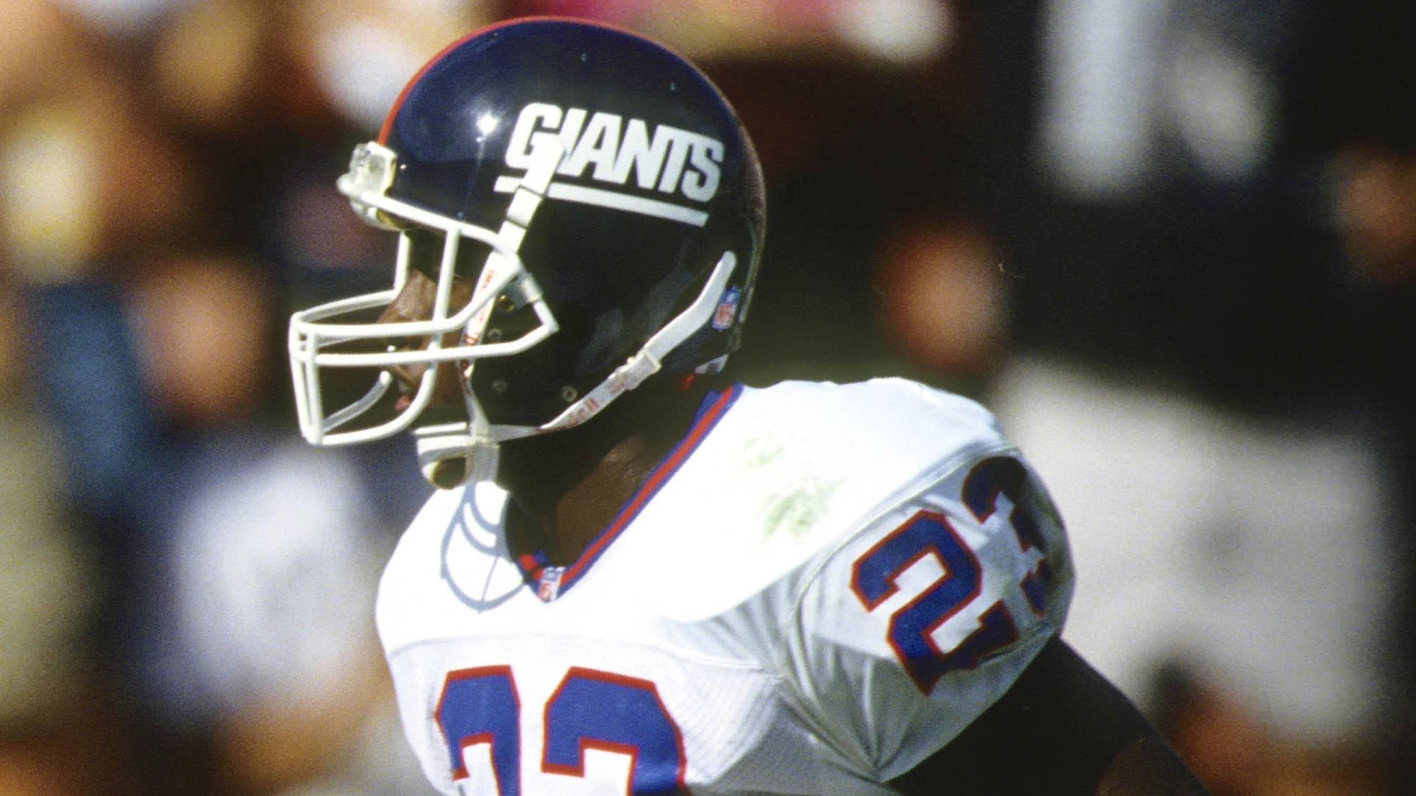 Oct 4, 1992; Los Angeles, CA, USA: FILE PHOTO; Los Angeles Raiders receiver Tim Brown scores a touchdown on a 68 yard pass reception in front of New York Giants defensive back Perry Williams (23) at the Coliseum.