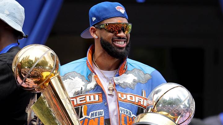 Jun 18, 2026; New York, NY, USA; New York Knicks center Karl-Anthony Towns celebrates with the Larry O'Brien championship trophy and the eastern conference finals trophy during a ceremony at New York City Hall after the championship parade. Mandatory Credit: Brad Penner-Imagn Images