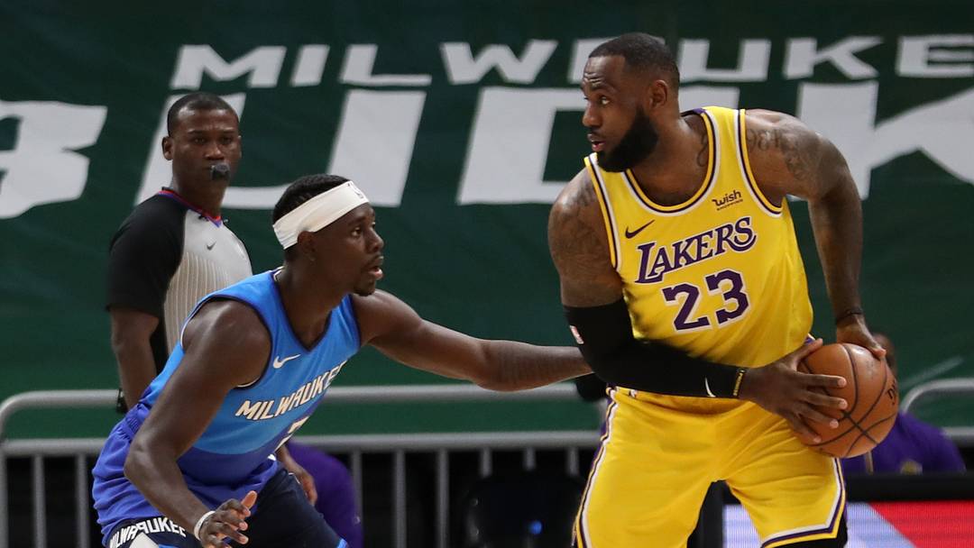 Jan 21, 2021; Milwaukee, WI, USA; Los Angeles Lakers forward LeBron James (23) is defended by Milwaukee Bucks guard Jrue Holiday (21) at the Bradley Center. Mandatory Credit: Nick Monroe/Handout Photo via USA TODAY Sports Jan 21, 2021; Milwaukee, WI, USA; Los Angeles Lakers forward LeBron James (23) is defended by Milwaukee Bucks guard Jrue Holiday (21) at the Bradley Center. Mandatory Credit: Nick Monroe/Handout Photo via USA TODAY Sports