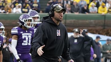 Nov 15, 2025; Chicago, Illinois, USA; Northwestern Wildcats head coach David Braun gestures to his team against the Michigan Wolverines during the first half at Wrigley Field. Mandatory Credit: David Banks-Imagn Images