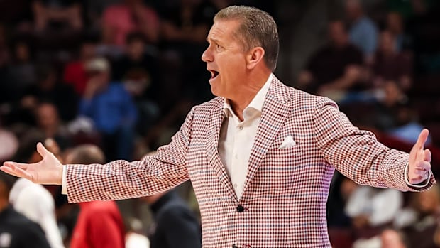 Razorbacks coach John Calipari disputes a call against South Carolina