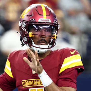Oct 19, 2025; Arlington, Texas, USA; Washington Commanders quarterback Jayden Daniels (5) passes the ball against the Dallas Cowboys during the first quarter of the game at AT&T Stadium. Mandatory Credit: Kevin Jairaj-Imagn Images
