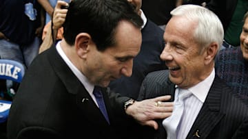 Mar 8, 2014; Durham, NC, USA; Duke Blue Devils head coach Mike Krzyzewski and North Carolina Tar Heels head coach Roy Williams greet each other before the start of their game at Cameron Indoor.