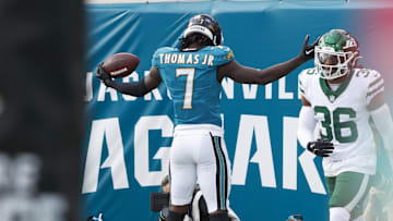 Dec 15, 2024; Jacksonville, Florida, USA; Jacksonville Jaguars wide receiver Brian Thomas Jr. (7) celebrates a touchdown against the New York Jets during the first quarter at EverBank Stadium. Mandatory Credit: Morgan Tencza-Imagn Images