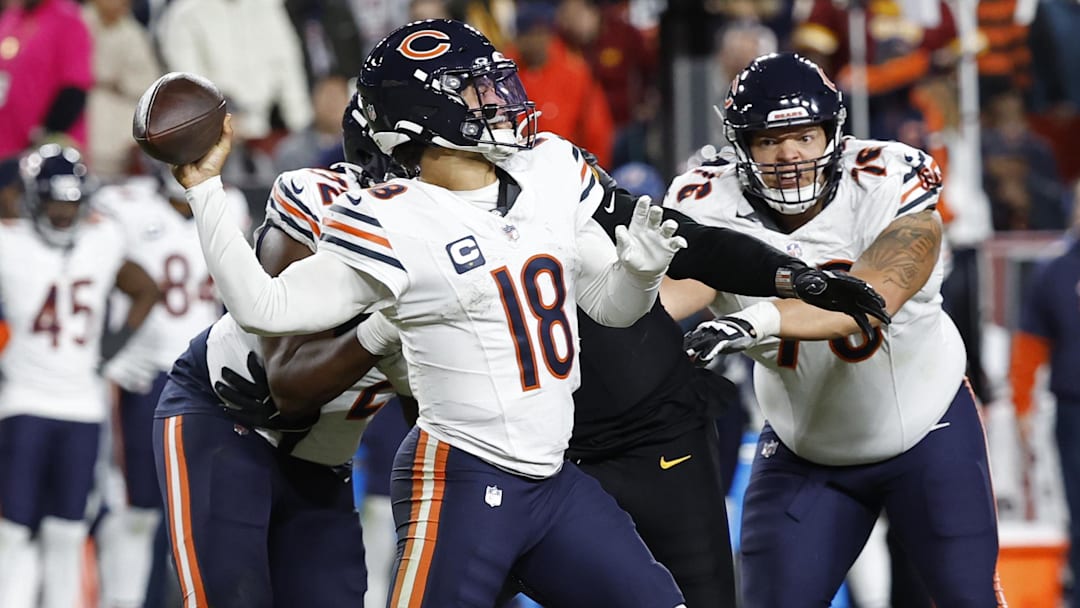 Oct 27, 2024; Landover, Maryland, USA; Chicago Bears quarterback Caleb Williams (18) passes the ball against the Washington Commanders during the third quarter at Northwest Stadium. Mandatory Credit: Geoff Burke-Imagn Images