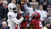 Harvard defensive back Mike Silva (25) breaks up a pass intended for Yale wide receiver Jaylan Sandifer (82)