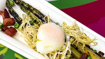Grilled asparagus with poached egg and spring peas