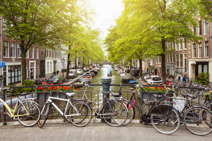 Bikes on a bridge over a canal in Amsterdam