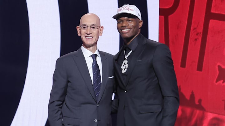 Jun 25, 2025; Brooklyn, NY, USA;  Cedric Coward stands with NBA commissioner Adam Silver after being selected as the 11th pick by the Portland Trail Blazers in the first round of the 2025 NBA Draft at Barclays Center. Mandatory Credit: Brad Penner-Imagn Images