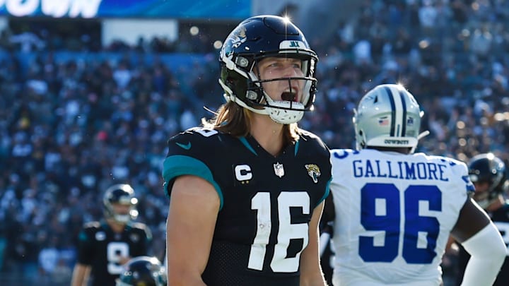 Jacksonville Jaguars quarterback Trevor Lawrence (16) celebrates after his touchdown pass to wide receiver Zay Jones (7) early in the fourth quarter gave his team the lead. The Jacksonville Jaguars hosted the Dallas Cowboys at TIAA Bank Field Sunday, December 18, 2022. The Jaguars trailed 21 to 7 at the half but came back to win 40 to 34 with a pick-six by Jacksonville Jaguars safety Rayshawn Jenkins (2) in overtime.t