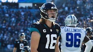 Jacksonville Jaguars quarterback Trevor Lawrence (16) celebrates after his touchdown pass to wide receiver.