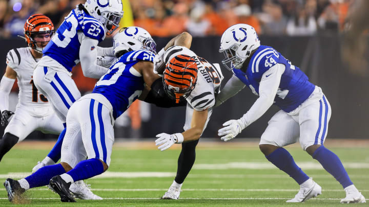 Aug 22, 2024; Cincinnati, Ohio, USA; Indianapolis Colts safety Nick Cross (20) and linebacker Zaire Franklin (44) bring down Cincinnati Bengals wide receiver Jermaine Burton (81) in the first half at Paycor Stadium. Mandatory Credit: 