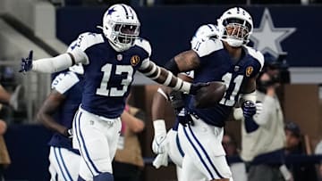 Dallas Cowboys linebacker DeMarvion Overshown (13) celebrates after scoring on a touchdown interception against the New York Giants during the first half at AT&T Stadium.