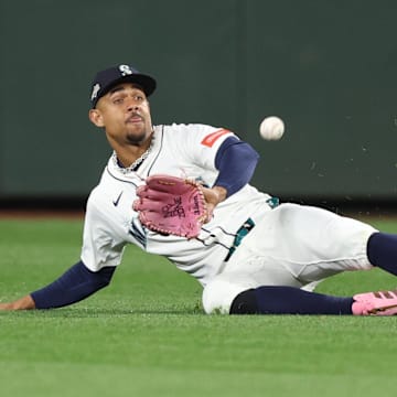 Oct 16, 2025; Seattle, Washington, USA; Seattle Mariners center fielder Julio Rodriguez (44) makes a catch in the ninth inning against the Toronto Blue Jays during game four of the ALCS round for the 2025 MLB playoffs at T-Mobile Park. Mandatory Credit: Kevin Ng-Imagn Images