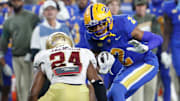 Nov 16, 2023; Pittsburgh, Pennsylvania, USA;  Pittsburgh Panthers wide receiver Kenny Johnson (2) runs after a catch as Boston College Eagles cornerback Amari Jackson (24) defends during the second quarter at Acrisure Stadium. Mandatory Credit: Charles LeClaire-Imagn Images