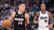 Jan 6, 2025; Sacramento, California, USA; Miami Heat guard Tyler Herro (14) controls the ball against the Sacramento Kings during the first quarter at Golden 1 Center.