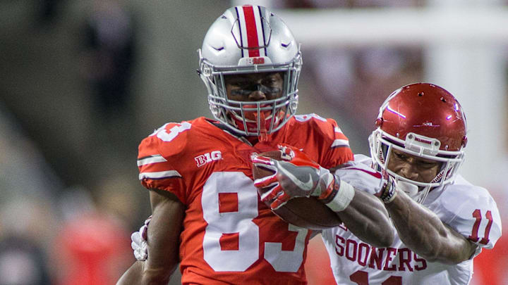 Sep 9, 2017; Columbus, OH, USA; Ohio State Buckeyes wide receiver Terry McLaurin (83) catches the ball and is tackled by Oklahoma Sooners cornerback Parnell Motley (11) in the second half of the game at Ohio Stadium. Mandatory Credit: Trevor Ruszkowski-Imagn Images Sep 9, 2017; Columbus, OH, USA; Ohio State Buckeyes wide receiver Terry McLaurin (83) catches the ball and is tackled by Oklahoma Sooners cornerback Parnell Motley (11) in the second half of the game at Ohio Stadium. Mandatory Credit: Trevor Ruszkowski-Imagn Images