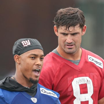 Jul 24, 2024; East Rutherford, NJ, USA; New York Giants wide receiver Wan'Dale Robinson (17) talks with quarterback Daniel Jones (8) during training camp at Quest Diagnostics Training Facility.  