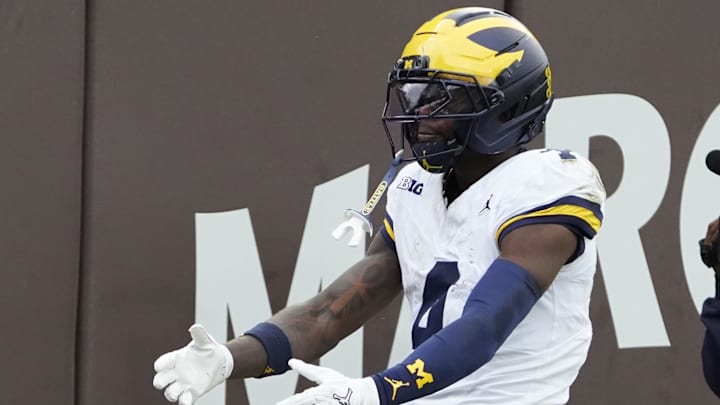 Nov 15, 2025; Chicago, Illinois, USA; Michigan Wolverines wide receiver Andrew Marsh (4) gestures after a first down against the Northwestern Wildcats during the first half at Wrigley Field. Mandatory Credit: David Banks-Imagn Images