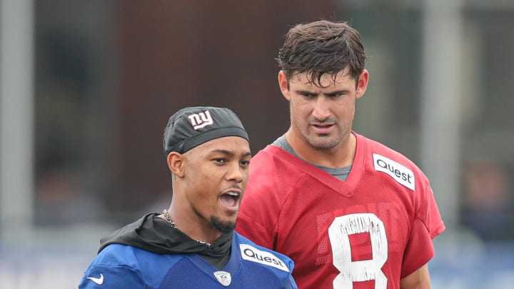 Jul 24, 2024; East Rutherford, NJ, USA; New York Giants wide receiver Wan'Dale Robinson (17) talks with quarterback Daniel Jones (8) during training camp at Quest Diagnostics Training Facility.  