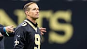 Oct 17, 2024; New Orleans, Louisiana, USA;  Former New Orleans Saints quarterback Drew Brees on the field for the coin toss against the Denver Broncos during the first half at Caesars Superdome. Mandatory Credit: Stephen Lew-Imagn Images