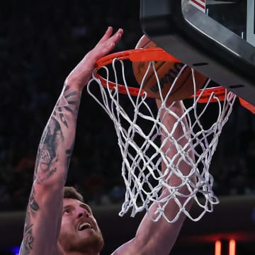 Oct 9, 2023; New York, New York, USA; New York Knicks center Isaiah Hartenstein (55) dunks the ball during the second half against the Boston Celtics at Madison Square Garden. Mandatory Credit: Vincent Carchietta-USA TODAY Sports