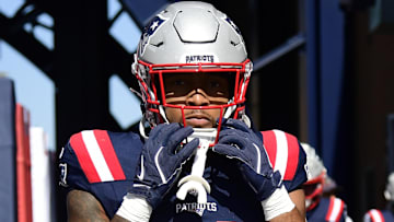 Sep 28, 2025; Foxborough, Massachusetts, USA; New England Patriots running back Treveyon Henderson (32) walks out onto the field for warmups prior to a game against the Carolina Panthers at Gillette Stadium.