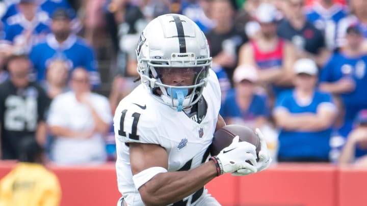 Sep 17, 2023; Orchard Park, New York, USA; Las Vegas Raiders wide receiver Tre Tucker (11) runs after making a catch against the Buffalo Bills in the first quarter at Highmark Stadium. Mandatory Credit: Mark Konezny-USA TODAY Sports