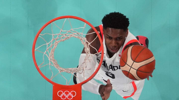 Jul 30, 2024; Villeneuve-d'Ascq, France; Canada small forward RJ Barrett (9) shoots against Australia in a men's group stage basketball match during the Paris 2024 Olympic Summer Games at Stade Pierre-Mauroy. Mandatory Credit: John David Mercer-USA TODAY Sports