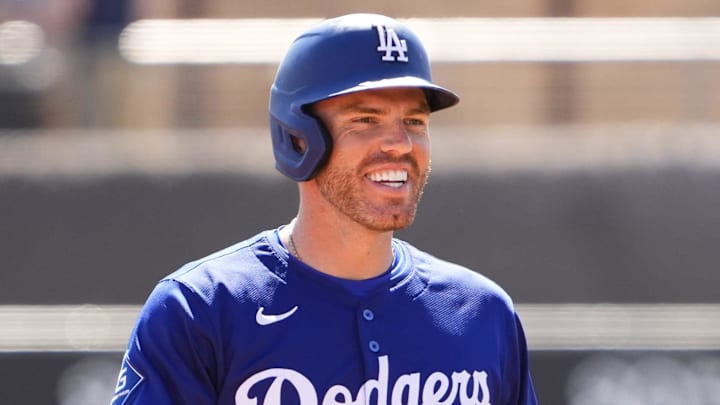 Los Angeles Dodgers first baseman Freddie Freeman smiles after getting on base during a Spring Training game. Los Angeles Dodgers first baseman Freddie Freeman smiles after getting on base during a Spring Training game.