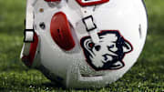 Oct 24, 2015; Cincinnati, OH, USA; A general view of a player holding a Connecticut Huskies helmet on the sidelines at Nippert Stadium. The Bearcats won 37-13. Mandatory Credit: Aaron Doster-Imagn Images