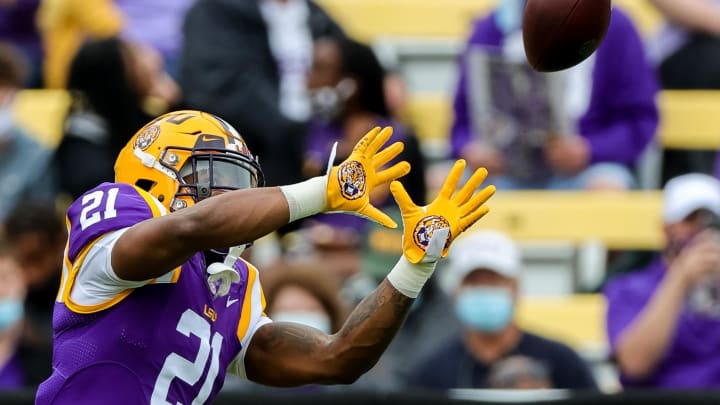 Apr 17, 2021; Baton Rouge, Louisiana, USA;  LSU Tigers safety Jordan Toles (21) catches a pass during warm ups before  the annual Purple and White spring game at Tiger Stadium. Mandatory Credit: Stephen Lew-USA TODAY Sports