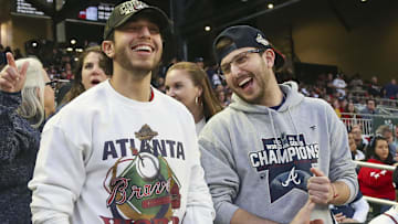  Atlanta Braves fans react before the game on Opening Day against the Cincinnati Reds at Truist Park.