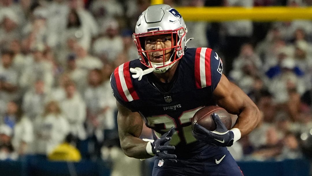 Oct 5, 2025; Orchard Park, New York, USA; New England Patriots running back Treveyon Henderson (32) runs with the ball against the Buffalo Bills during the second half at Highmark Stadium.