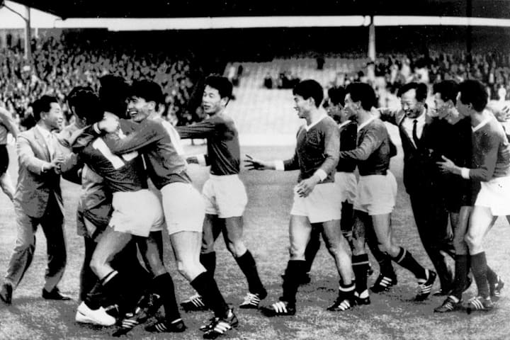 North Korean national soccer team players celebrat