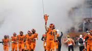 Nov 1, 2013; Corvallis, OR, USA;  Oregon State Beavers defensive end Dylan Wynn (45) carries a chainsaw as he leads the Beavers into Reser Stadium to play USC Trojans. Mandatory Credit: Jaime Valdez-Imagn Images