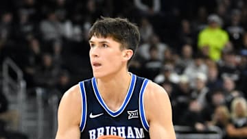 Dec 3, 2024; Providence, Rhode Island, USA; Brigham Young Cougars guard Egor Demin (3) shoots over Providence Friars guard Corey Floyd Jr. (14) during the second half at Amica Mutual Pavilion. Mandatory Credit: Eric Canha-Imagn Images