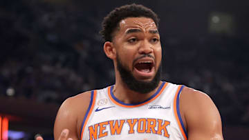 Oct 22, 2025; New York, New York, USA; New York Knicks center Karl-Anthony Towns (32) argues with referee Matt Kallio (53) during the first quarter against the Cleveland Cavaliers at Madison Square Garden. Mandatory Credit: Brad Penner-Imagn Images