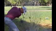 Justin Thomas hits a ball out of muddy water at the RBC Heritage.