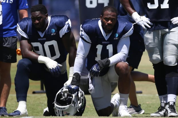 Dallas Cowboys defensive end DeMarcus Lawrence (90) and linebacker Micah Parsons (11)